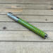 Light blue and yellow magnetic cap rollerball pen with honeycomb pattern
