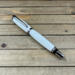 Chrome rollerball pen with white acrylic body