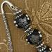Good closeup of black beads and hook.