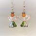 Green and silver skirt closeup of little angel earrings with crystal wings
