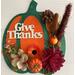 A 3D decorative pumpkin for the fall and Thanksgiving.  Hancrafted and available in two different foliage and paints for "Give Thanks". Beautiful orange and dark green are the main colors but the harvest was plentiful with choices of flowers and fall items.