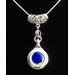 A stunning new authentic silver flute plateau key with a cobalt blue crystal stone.  A filigree curved medium size bail has a leaf design to hole the key pendant. 18" silver plated snake chain. Wearable gorgeous jewelry for everyone!

COBALT BLUE