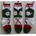 Santa faces and candy canes on hand knit Christmas stocking