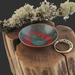 tiny copper enamel trinket dish dark teal with stenciled red leaf outline