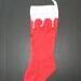 back side of hand knit Christmas stocking red and white.