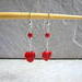 Earrings hang 1.75 inches from sterling silver ear wires