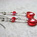 The clear red glass heart will steal the show, accented with a sparkling red crystal bead wire wrapped above.