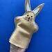 Rabbit puppet for child, shown on adult hand