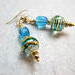 Swirls of gold and blue on a clear bead