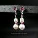 ​This is a lovely pair of pearl and rhodolite garnet earring jackets. They are made with cultured freshwater pearls and with faceted pink rhodolite rondelles and sterling silver beads. By MariesGems.
